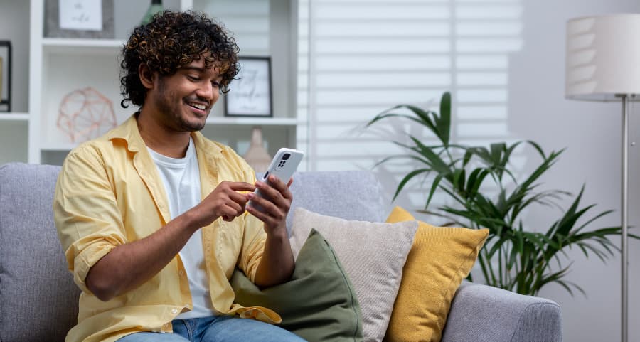 Homeowner accessing a home security app on his smartphone